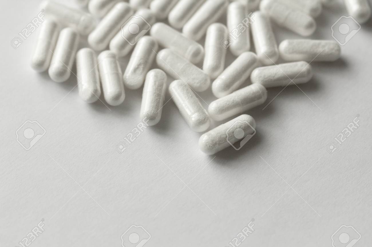 White Transparent Capsules or Tablets on the White Background. Medications and Pills. - 121006245 White Transparent Capsules or Tablets on the White Background. Medications and Pills. - 121006245