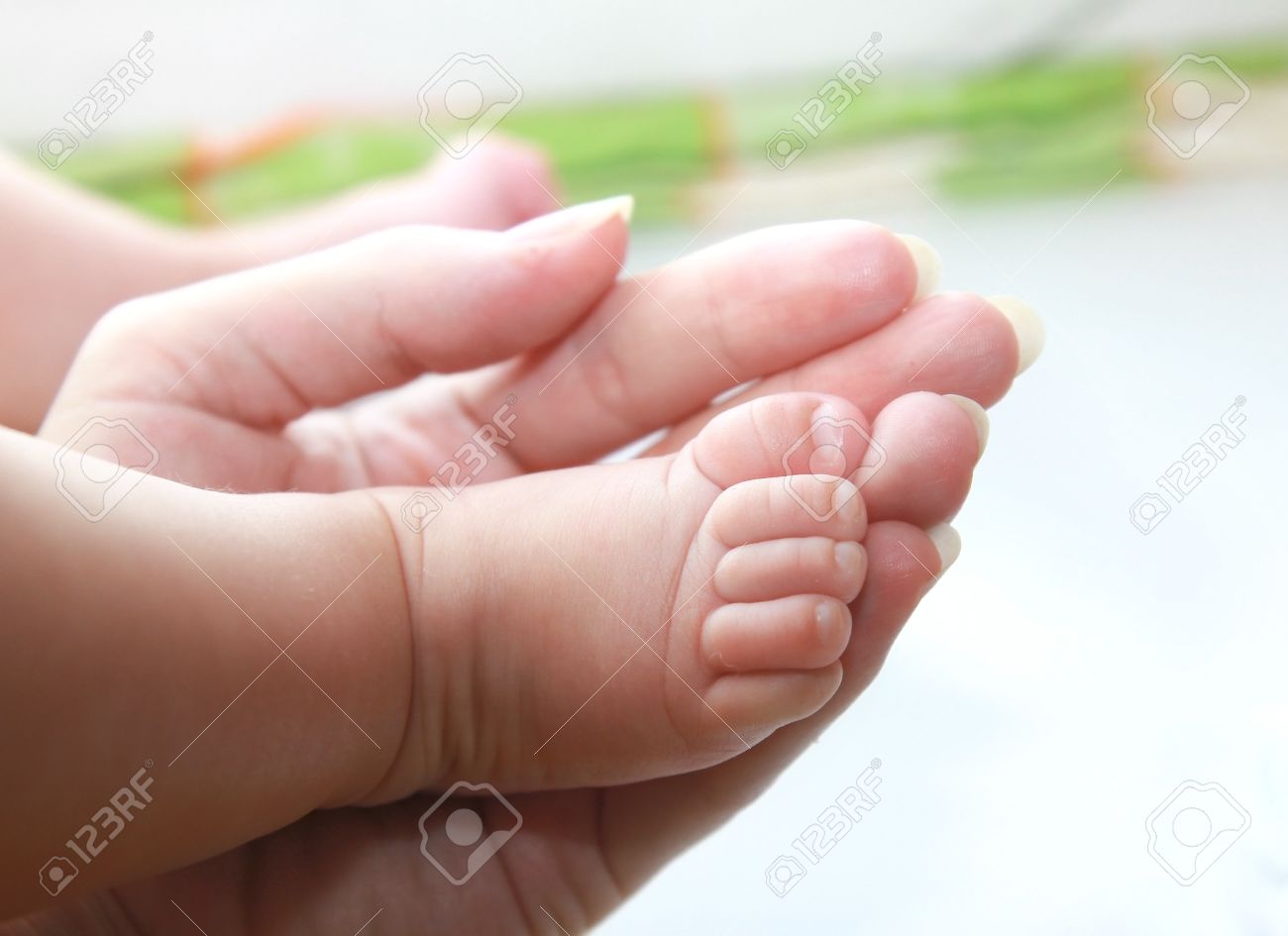 Closeup Hand Of Mother Holding Small Baby Girl Foot Stock Photo ...