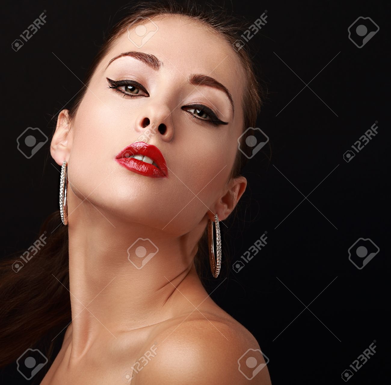 Sexy Hot Woman Makeup Face In Fashion Earrings Looking. Closeup Portrait On  Black Stock Photo, Picture and Royalty Free Image. Image 32693846.
