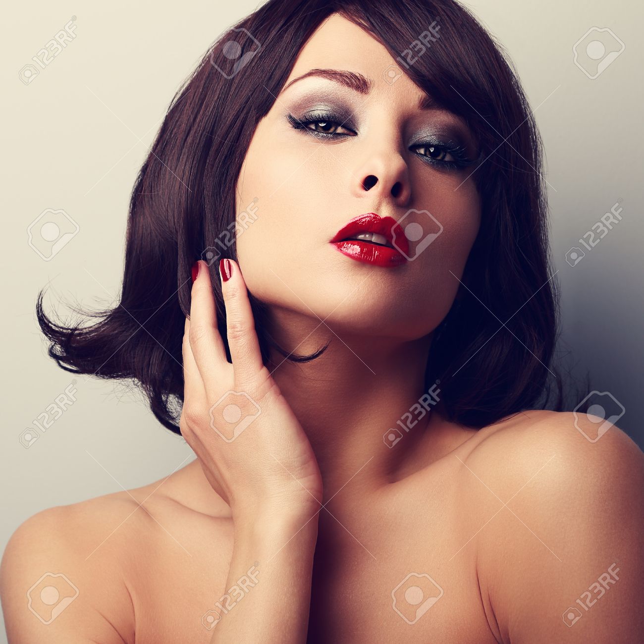 Hot Sexy Makeup Model With Short Black Hair Style And Red Lipstick