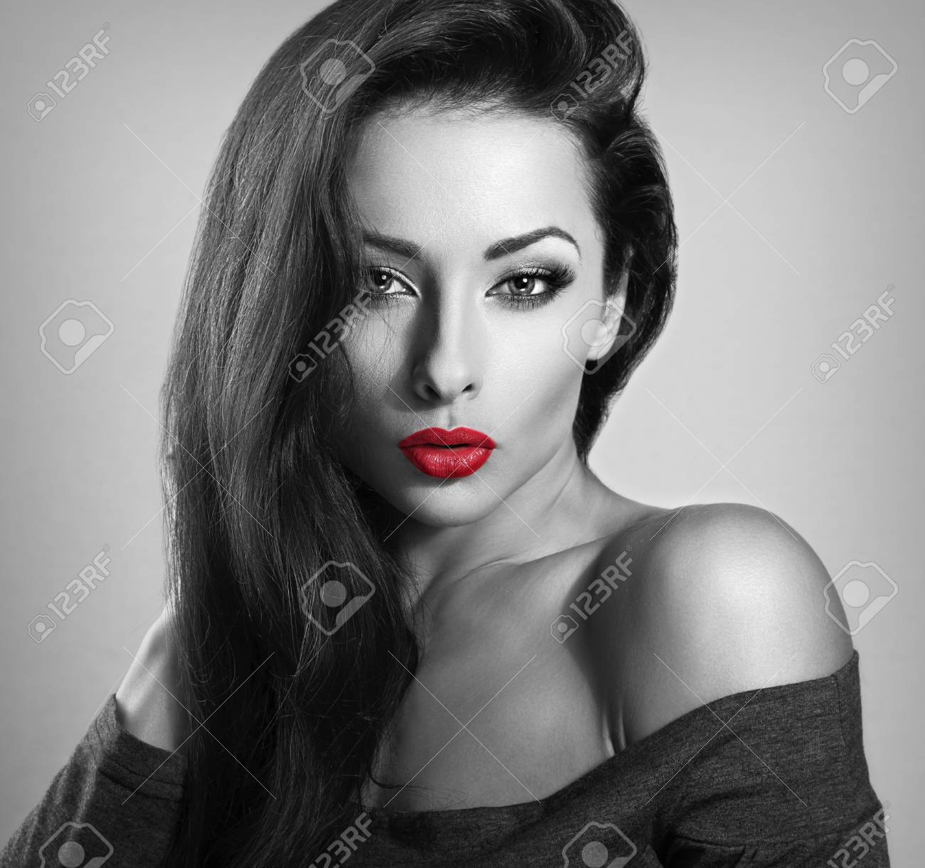 Beautiful brunette make up sexy woman with red lipstick looking