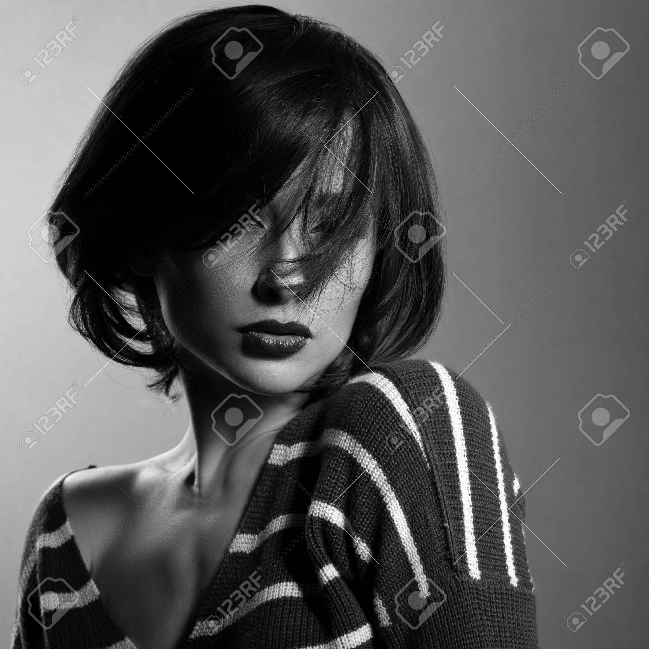 Beautiful Enjoing Woman Moving And Shaking Her Short Black Hair