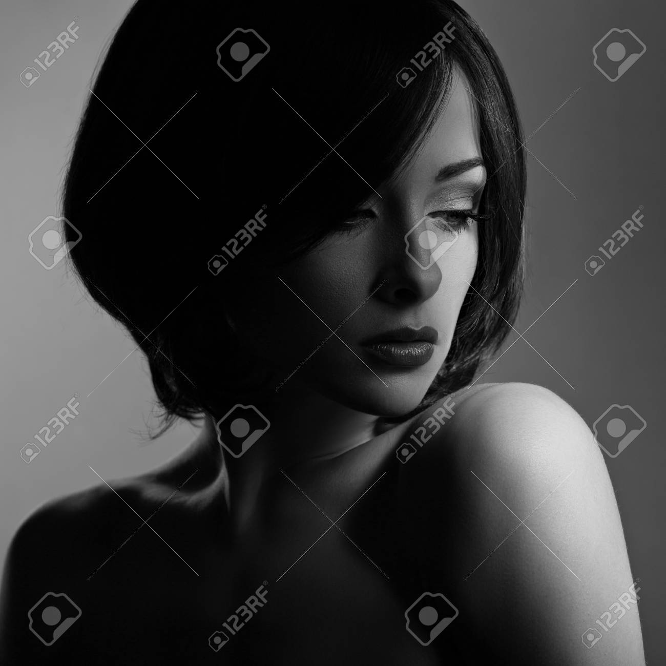 Beautiful Makeup Woman With Thinking Sad Look And Short Hair