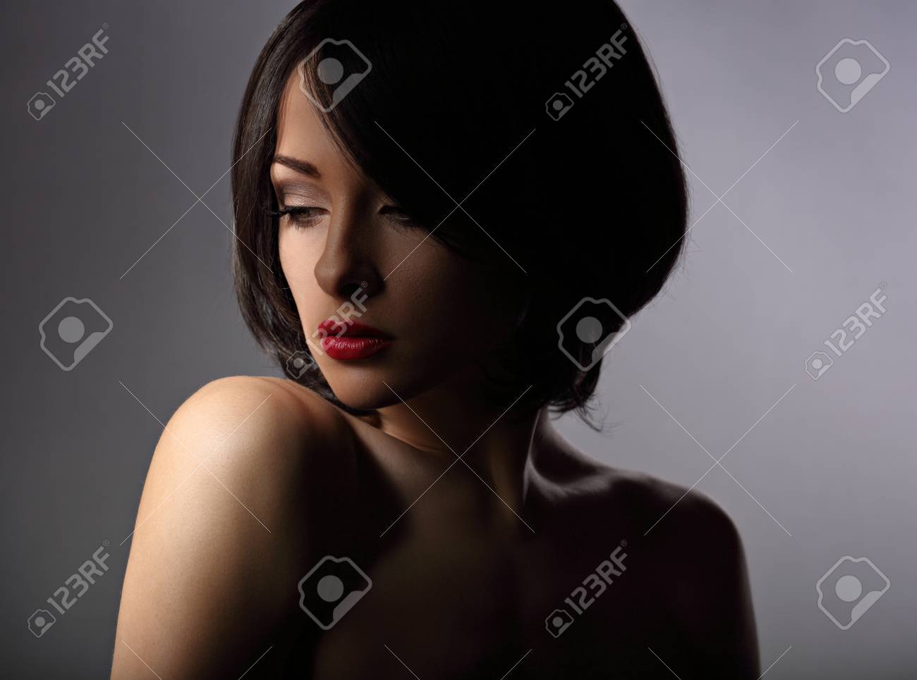 Beautiful Makeup Woman With Thinking Sad Look And Short Hair