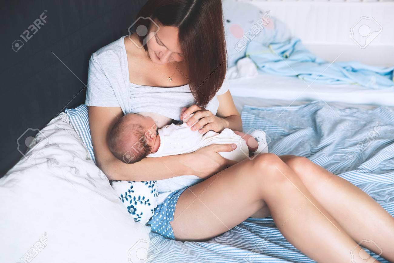 beautiful mother breastfeeding baby