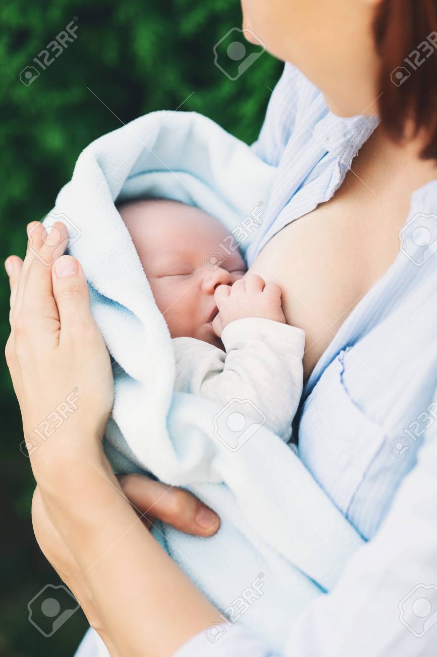 beautiful mother breastfeeding baby