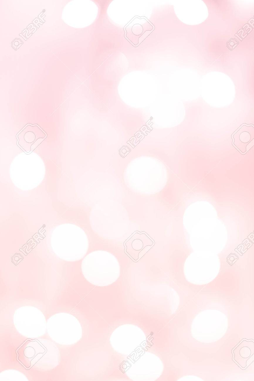 White Natural Defocused Bokeh Lights On A Soft Pink Gradient