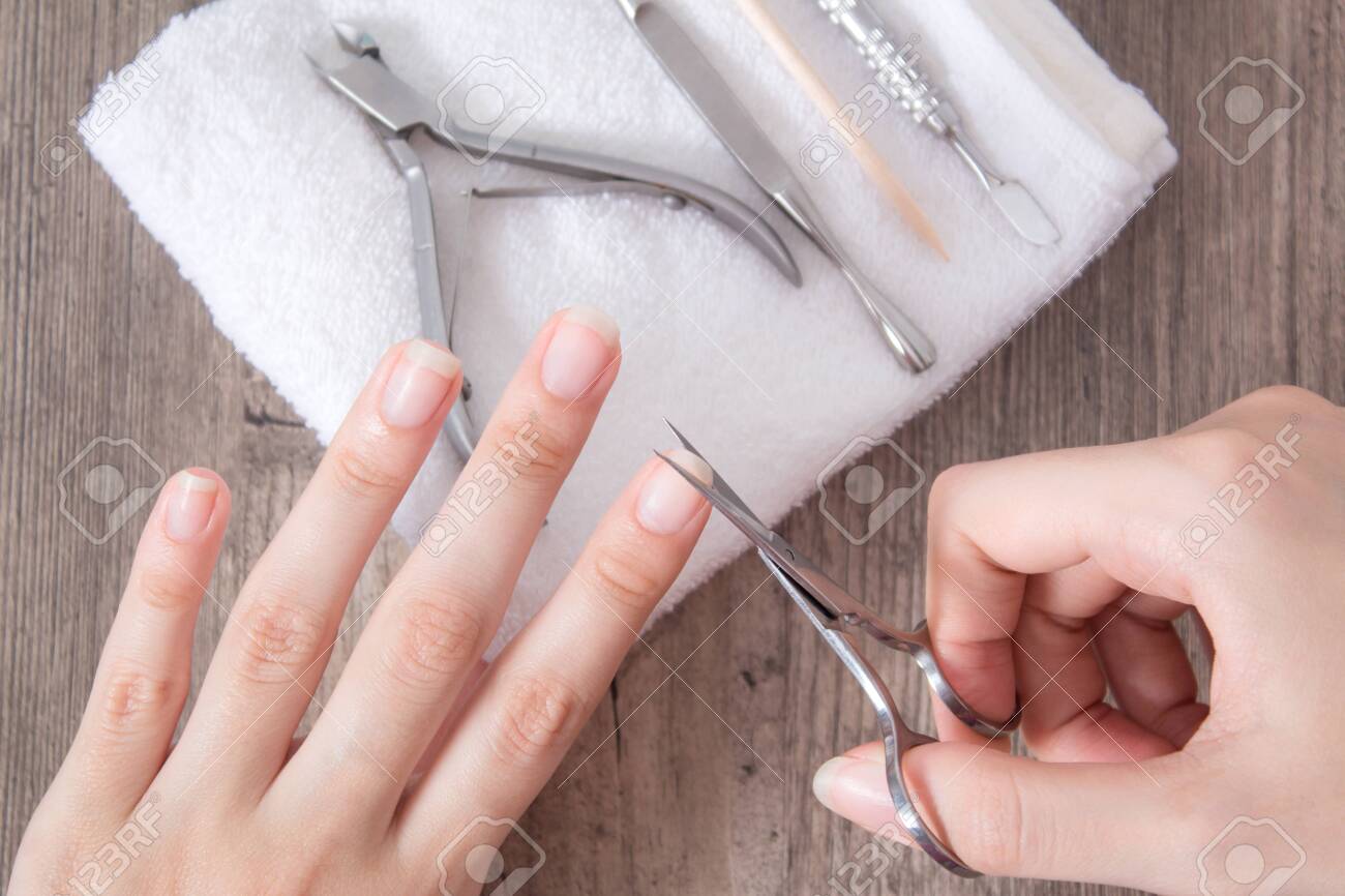 Trim The Nails On The Hand. Do Yourself A Manicure. Shorten Long Nails. Home Nail Care, Trim The Nails On The Hand. Do Yourself A Manicure. Shorten Long Nails. Home Nail Care,