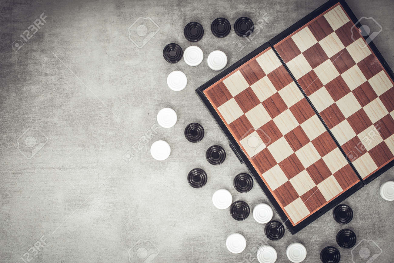 Checkers Are Scattered Near The Chessboard, Top View. Mind Games ...