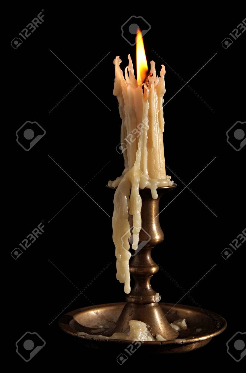 Burning Candle In Old Silver Candlestick Isolated On Black . Stock Photo,  Picture And Royalty Free Image. Image 35268349.
