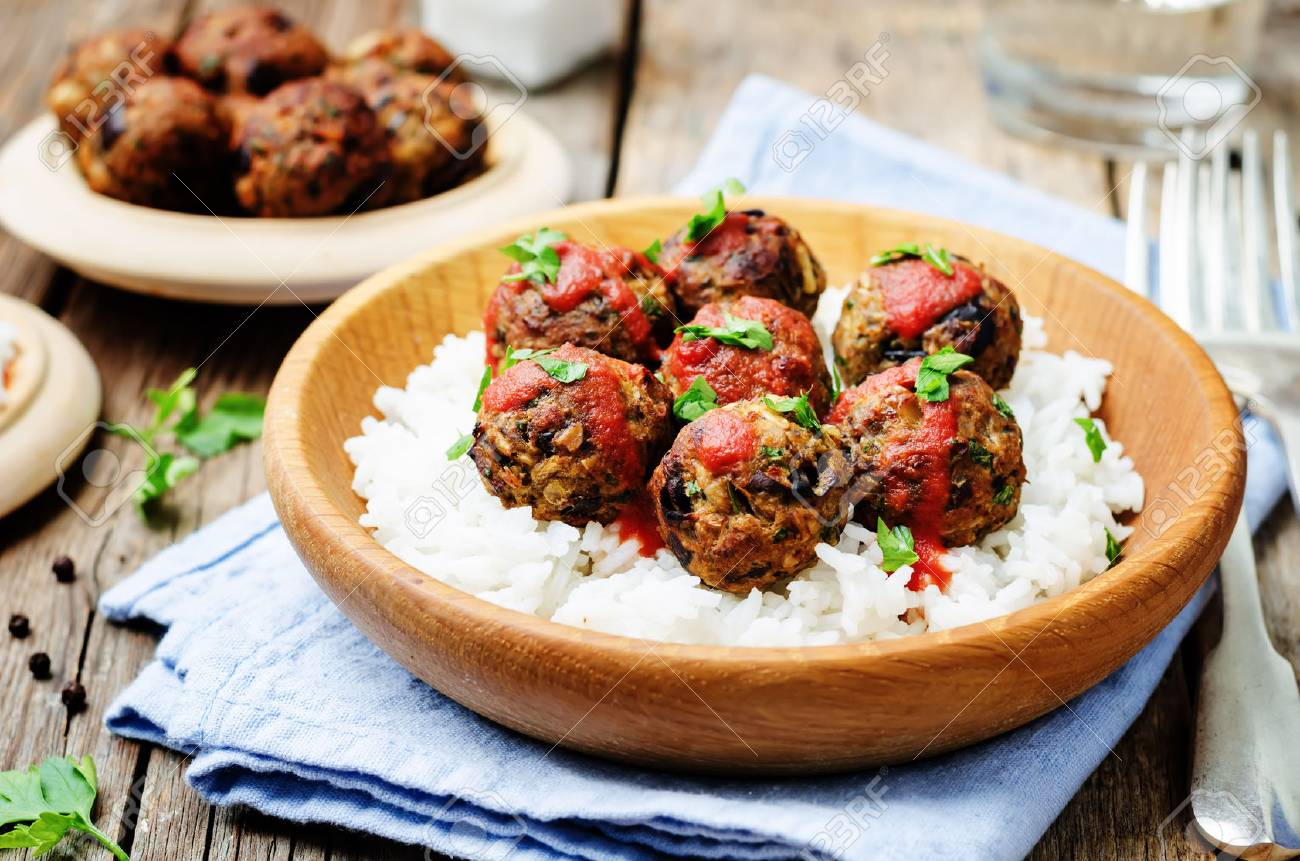 Eggplant white beans vegan meatballs with tomato sauce and rice. toning. selective focus - 55671226 Eggplant white beans vegan meatballs with tomato sauce and rice. toning. selective focus - 55671226
