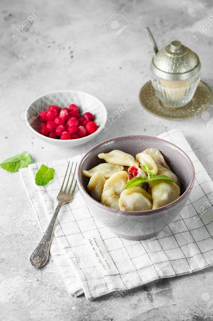 Cherry Dumplings With Mint Homemade Sweet Dumplings With Berries Stock Photo Picture And Royalty Free Image Image 128738921