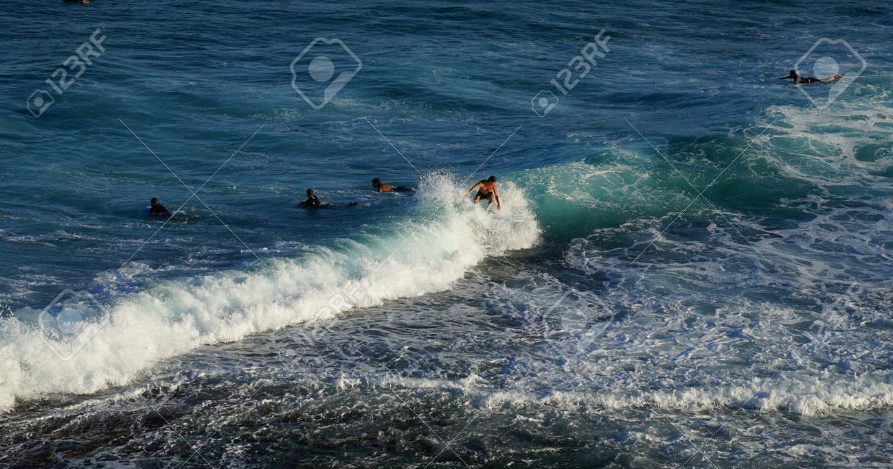Australian Young Man And Lady Surfing At Tamarama Beach In Sydney Stock Photo Picture And Royalty Free Image Image