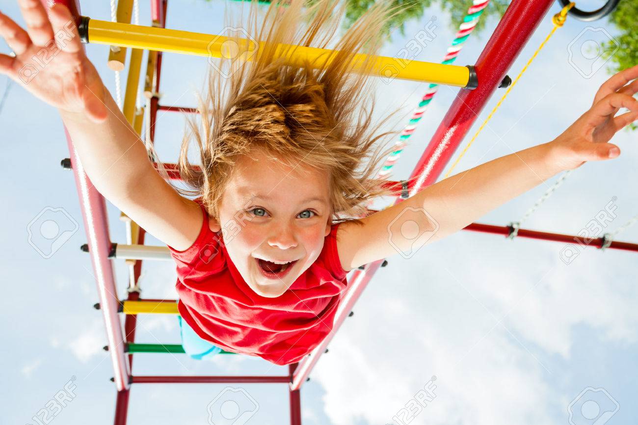 Little girl having fun playing on monkey bars - 29227770 Little girl having fun playing on monkey bars - 29227770
