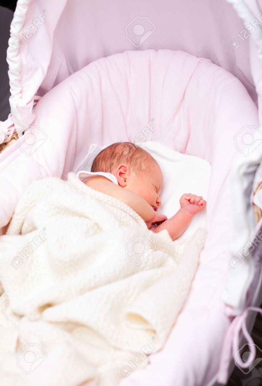 newborn baby girl sleeping in a bassinette stock photo picture and new baby girl pic
