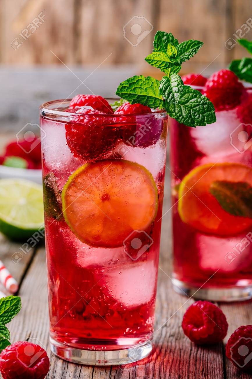 Raspberry Mojito Lemonade With Lime And Fresh Mint In Glass On Stock Photo Picture And Royalty Free Image Image 104450448