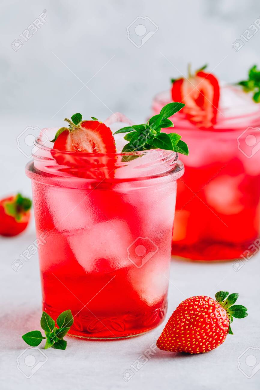 Strawberry Basil Iced Tea Or Lemonade In A Jars On A Gray Stone Stock Photo Picture And Royalty Free Image Image 128122268