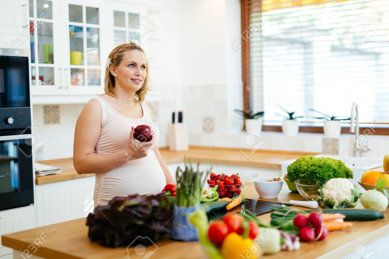 Pregnant Woman Healthy Eating Vegetables And Fruit Stock Photo ... Pregnant Woman Healthy Eating Vegetables And Fruit Stock Photo ...