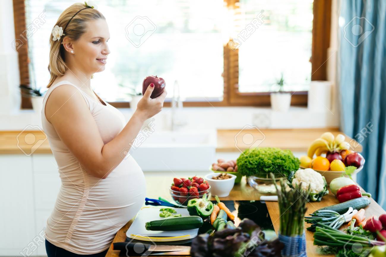 Pregnant Woman Healthy Eating Vegetables And Fruit Stock Photo ... Pregnant Woman Healthy Eating Vegetables And Fruit Stock Photo ...