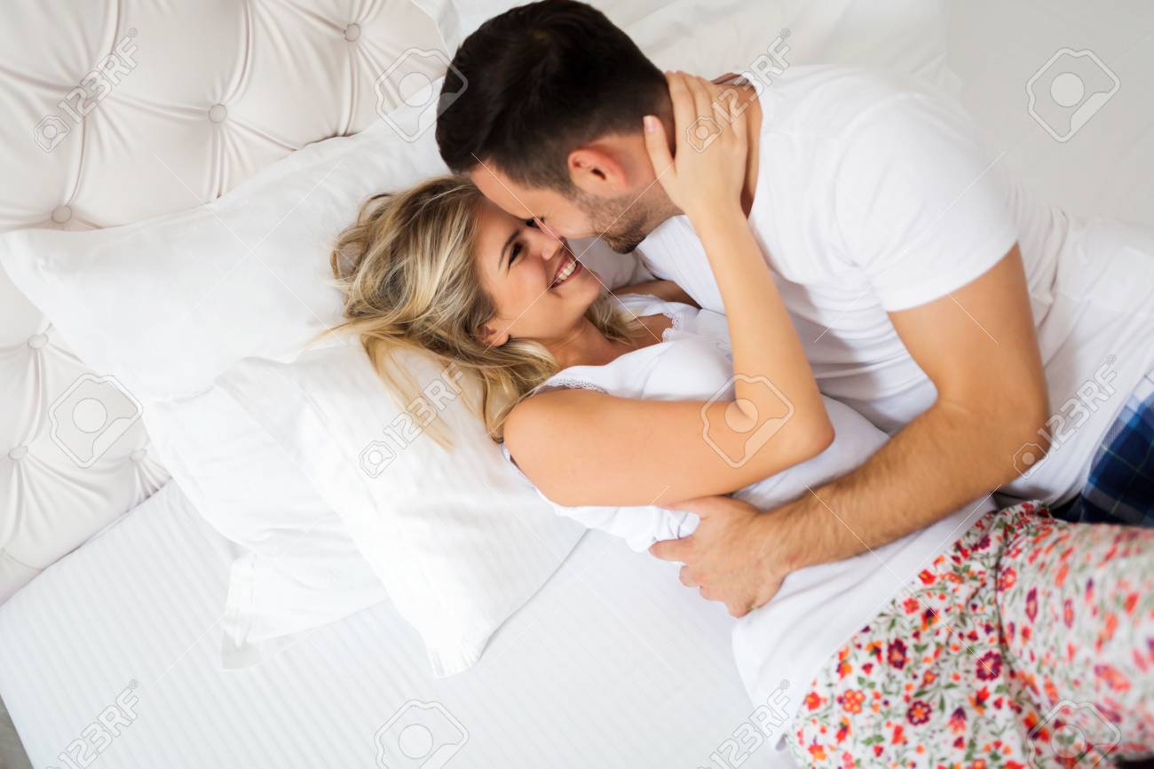 Young Couple Having Having Romantic Times In Bedroom