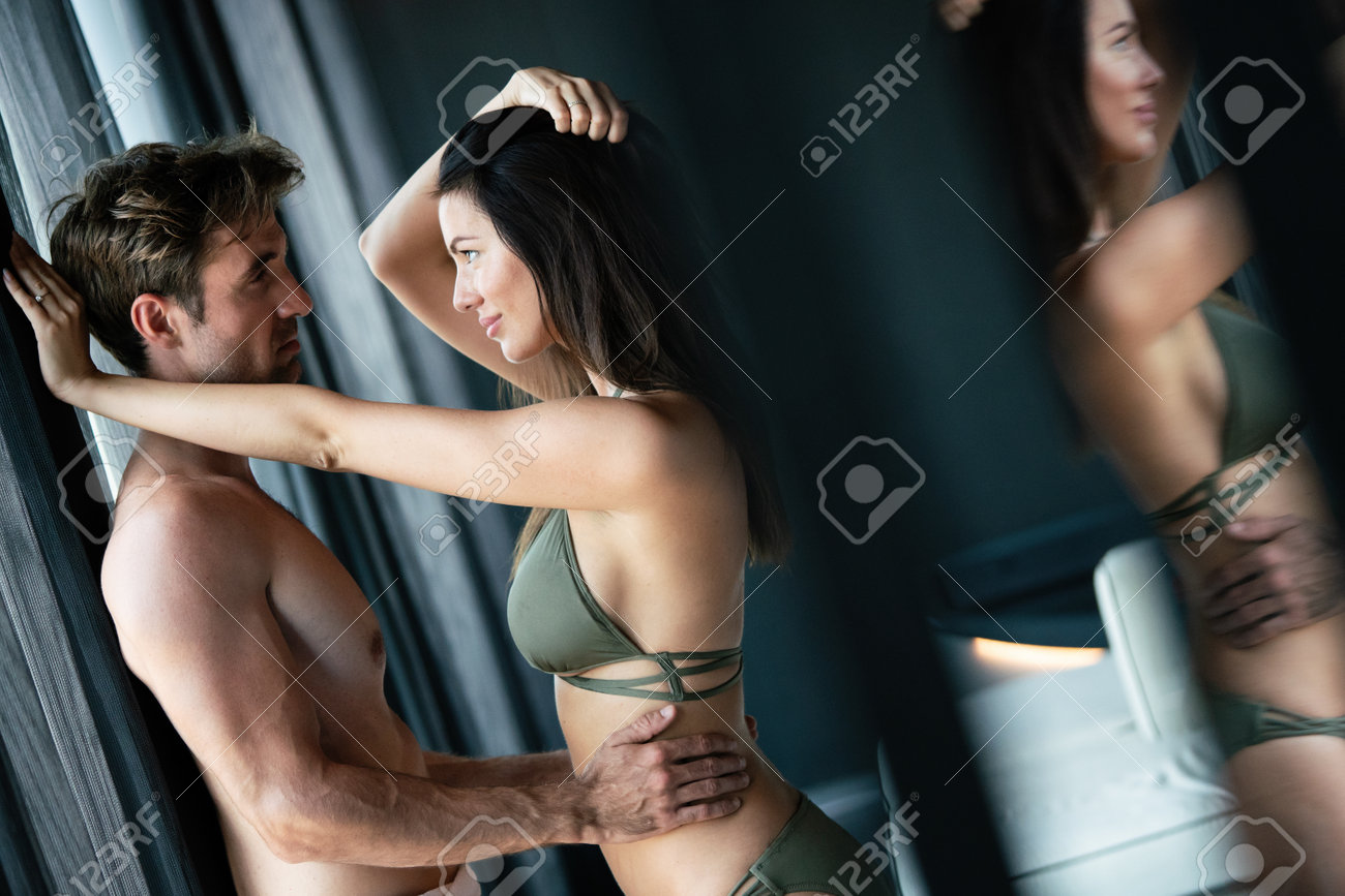 Young Happy Sexy Couple Relaxing In Love At Home Stock Photo, Picture and  Royalty Free Image. Image 161906109.