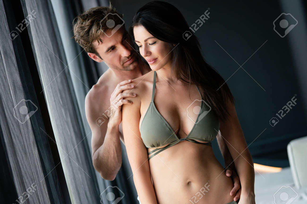 Young Happy Sexy Couple Relaxing In Love At Home Stock Photo, Picture and  Royalty Free Image. Image 186218775.