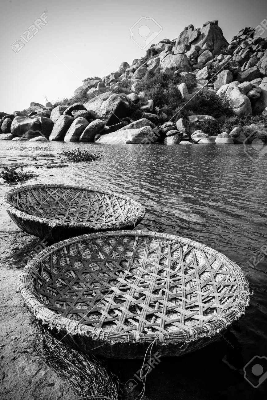 Stock photo traditional rural coracle boats on tungabhadra river in hampi in black and white