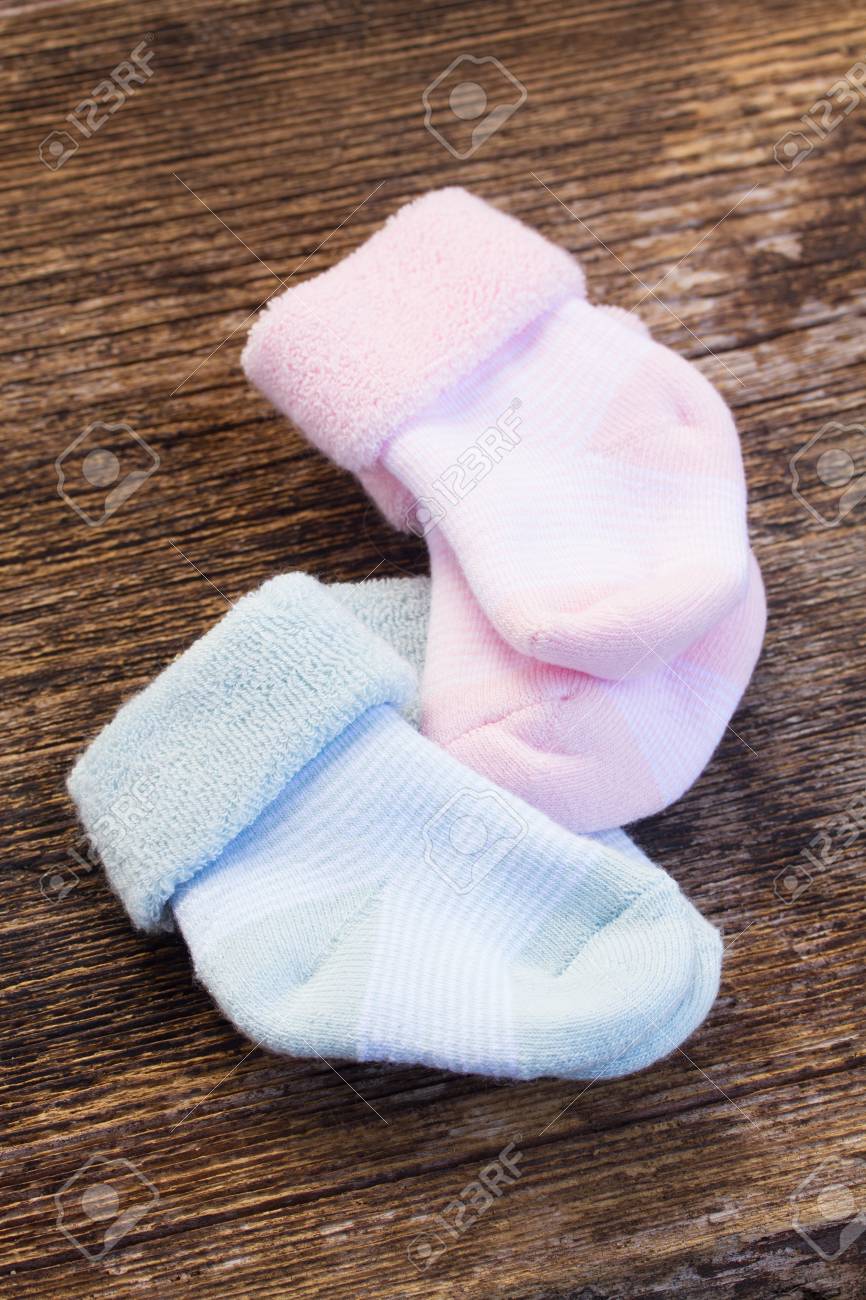 Newborn Baby Pink And Blue Socks On Wooden Background Stock Photo Picture And Royalty Free Image Image 33510583