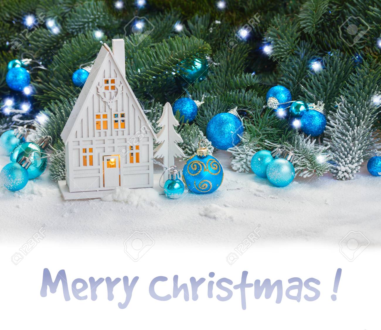 White christmas house with blue decorations in snow border on white and sample text Merry Christmas - 49233685 White christmas house with blue decorations in snow border on white and sample text Merry Christmas - 49233685