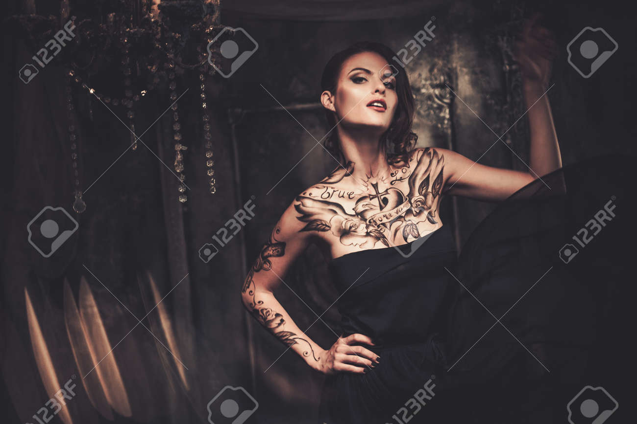 tattooed beautiful woman in old spooky interior stock photo tattooed beautiful woman in old spooky interior stock photo