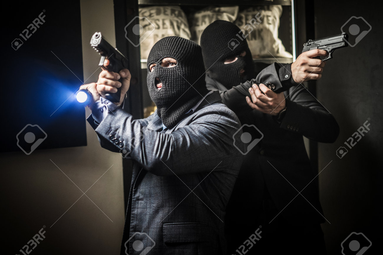 Two ardmed men robbing a bank - 127121147 Two ardmed men robbing a bank - 127121147