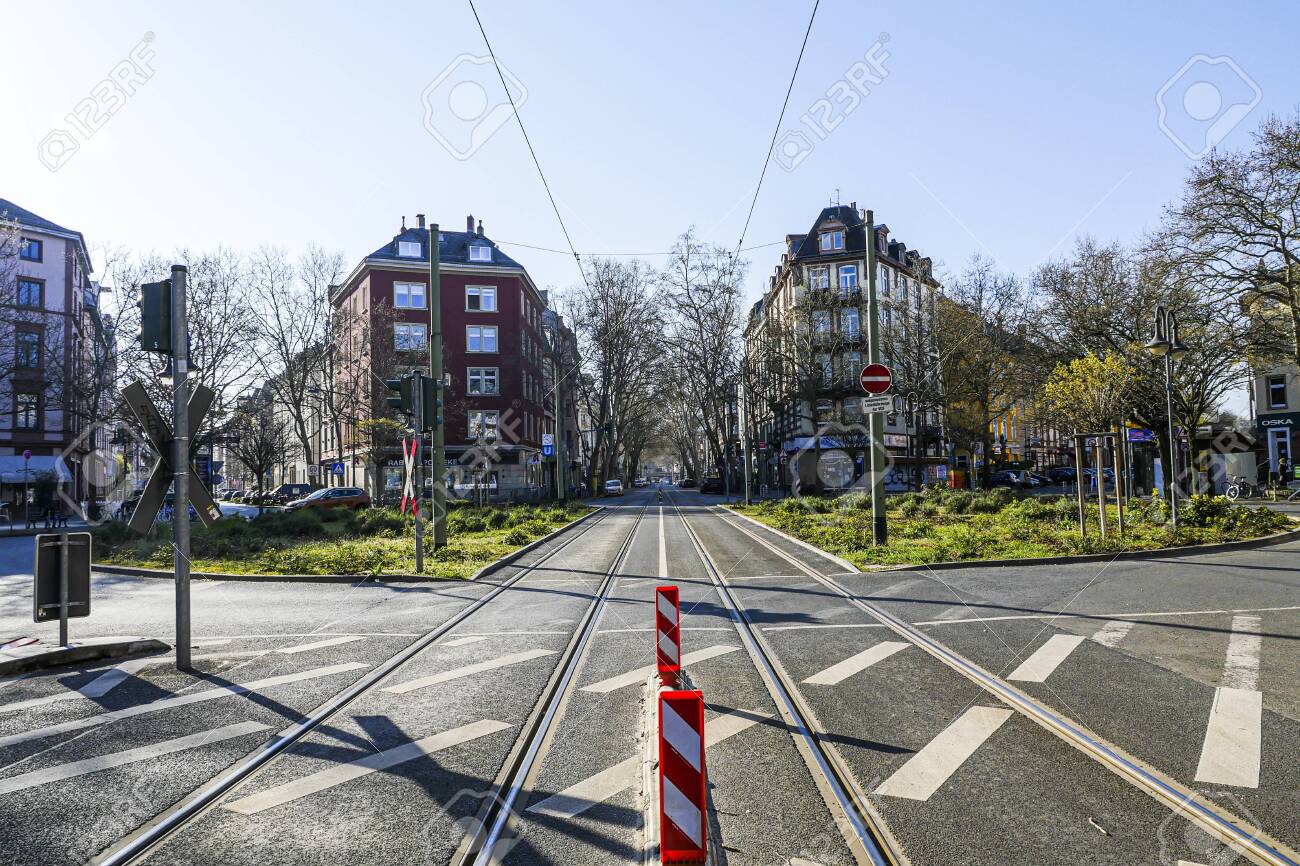 Coronavirus lockdown. Frankfurt, Germany. April 5, 2020. Schweizer Platz crosswalk with empty streets during quarantine. - 144821541 Coronavirus lockdown. Frankfurt, Germany. April 5, 2020. Schweizer Platz crosswalk with empty streets during quarantine. - 144821541
