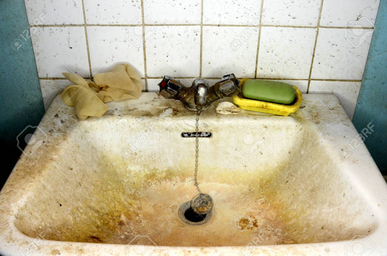 https://previews.123rf.com/images/nemoris/nemoris1912/nemoris191200179/135733517-messy-bathroom-sink-with-dirty-tap-soap-and-wall.jpg