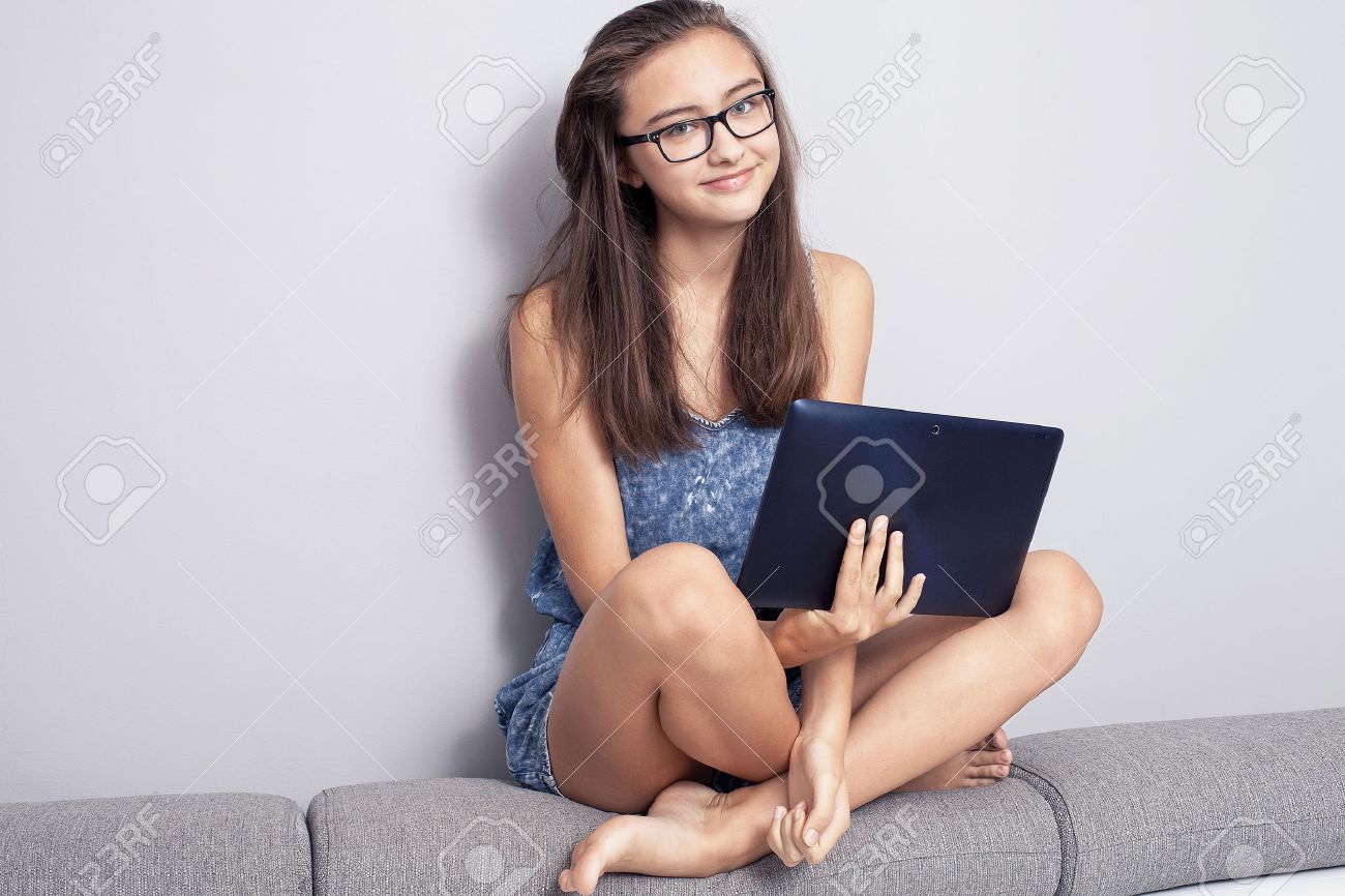 Young Beautiful Teenage Girl Sitting