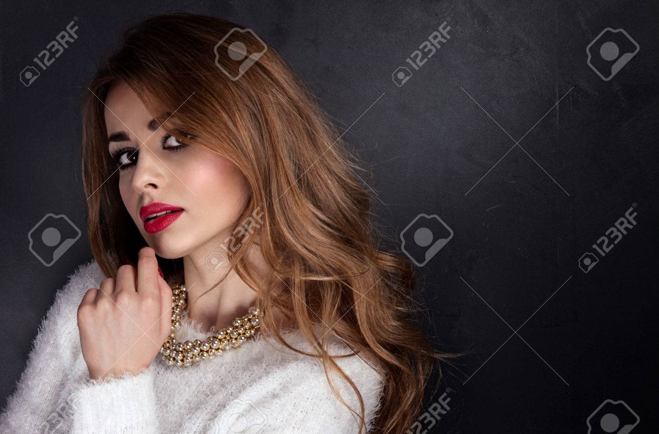 Portrait of a beautiful woman with long curly hairs Portrait of a beautiful woman with long curly hairs