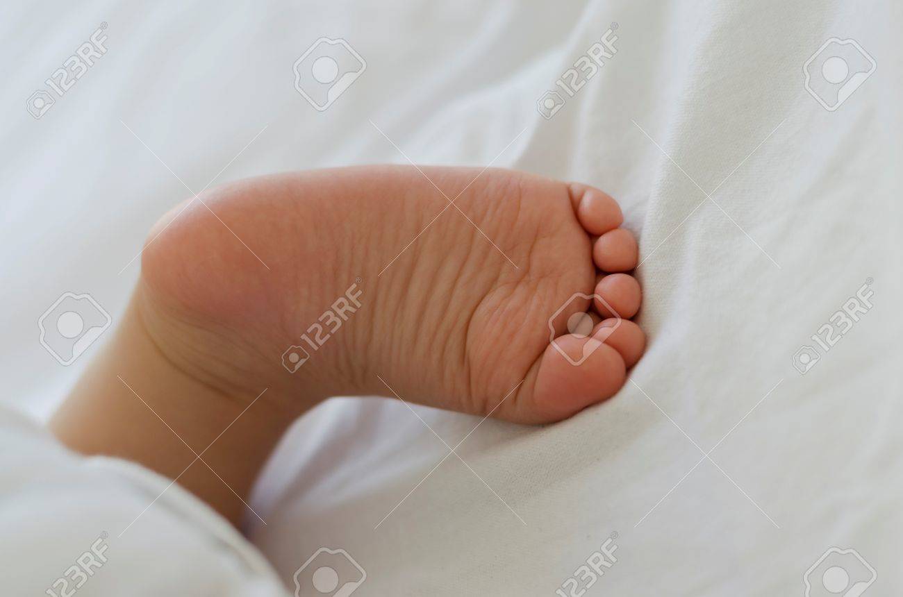 Cute Tiny Little White Baby Feet Stock Photo Picture And Royalty