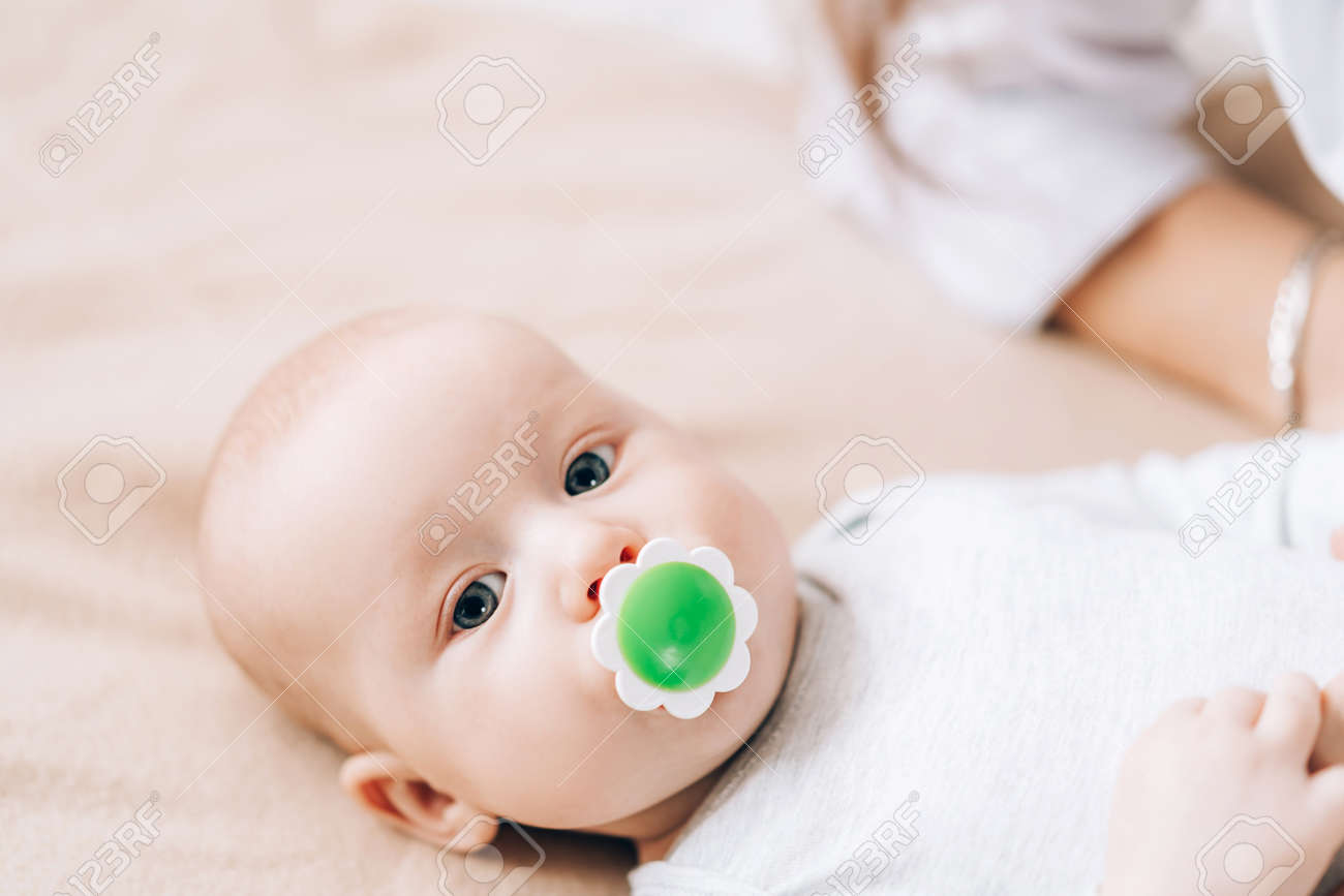 Small child has in its mouth. - 169603058 Small child has in its mouth. - 169603058