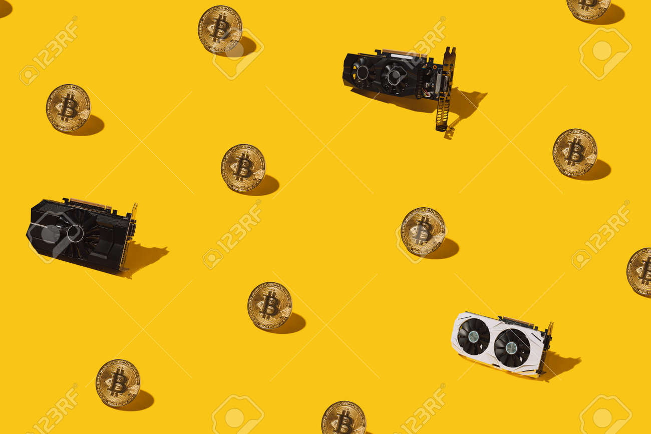 Golden pattern from bitcoin cryptocurrency and video cards. Cryptocurrency mining concept. - 169602962 Golden pattern from bitcoin cryptocurrency and video cards. Cryptocurrency mining concept. - 169602962