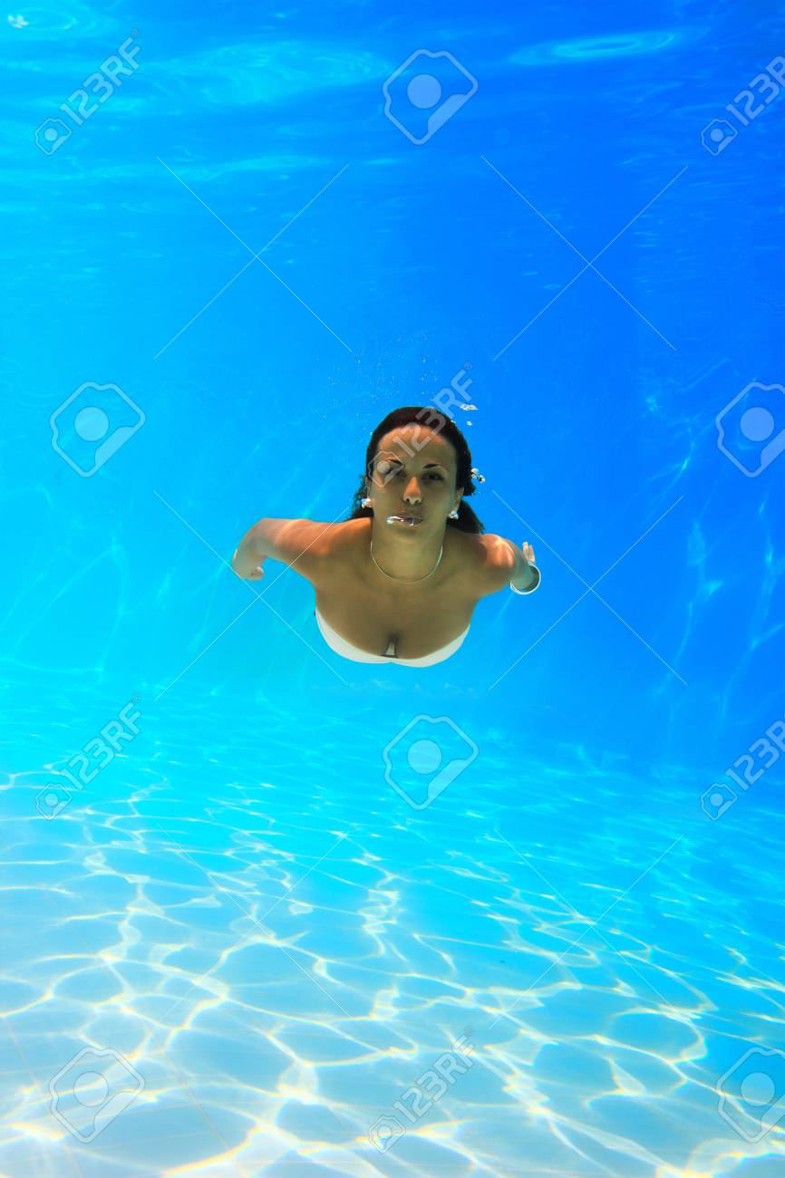 Woman Swimming Underwater At The Pool Stock Photo, Picture and Royalty Free  Image. Image 19185533., image size:866x1300