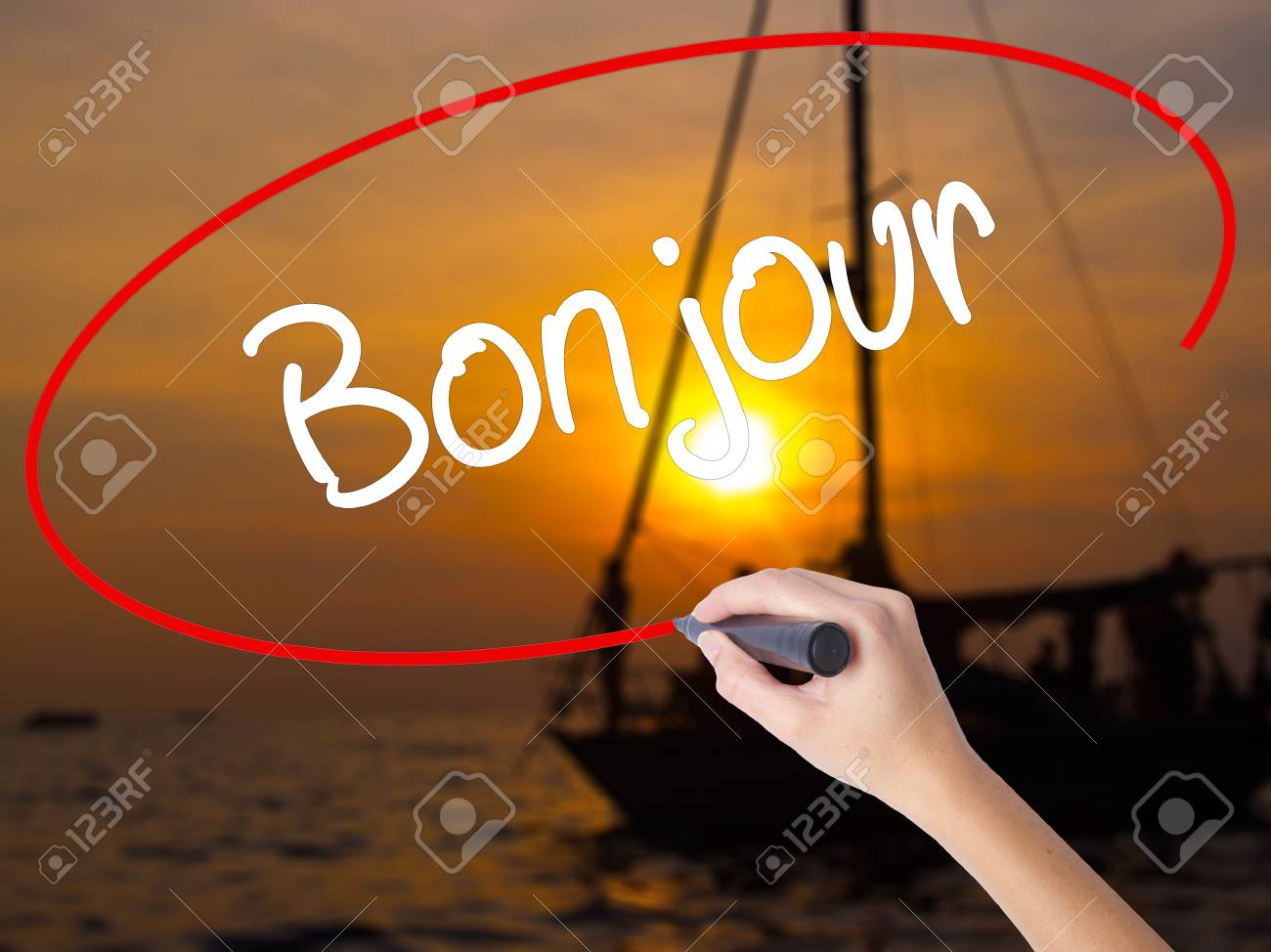 Woman Hand Writing Bonjour Good Morning In French With A Marker Stock Photo Picture And Royalty Free Image Image 67749885