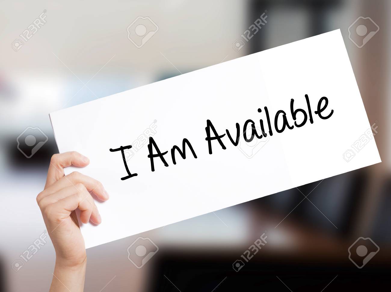 I Am Available Sign On White Paper Man Hand Holding Paper With Stock Photo Picture And Royalty Free Image Image