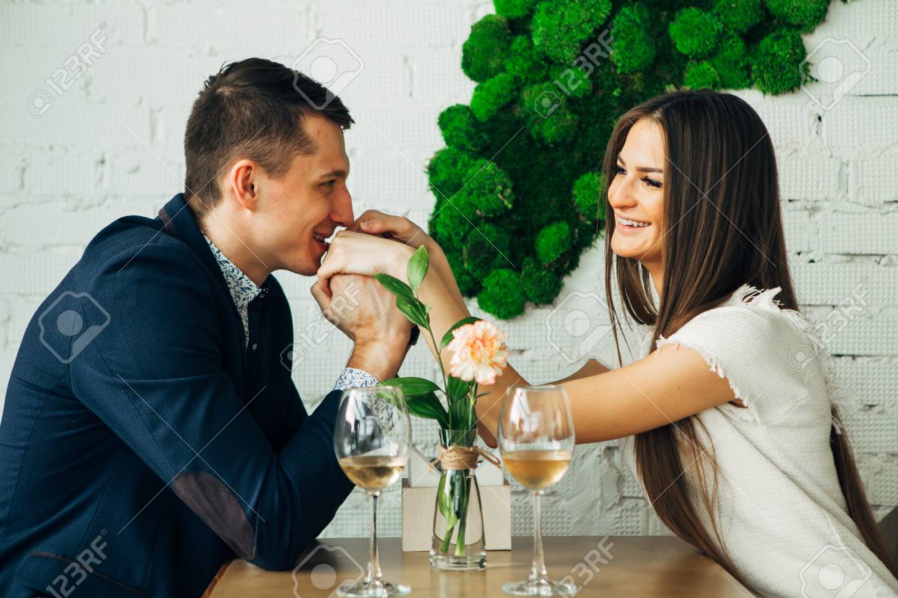 Couple celebrate Valentines day with romantic dinner in restaurant - 97567482 Couple celebrate Valentines day with romantic dinner in restaurant - 97567482
