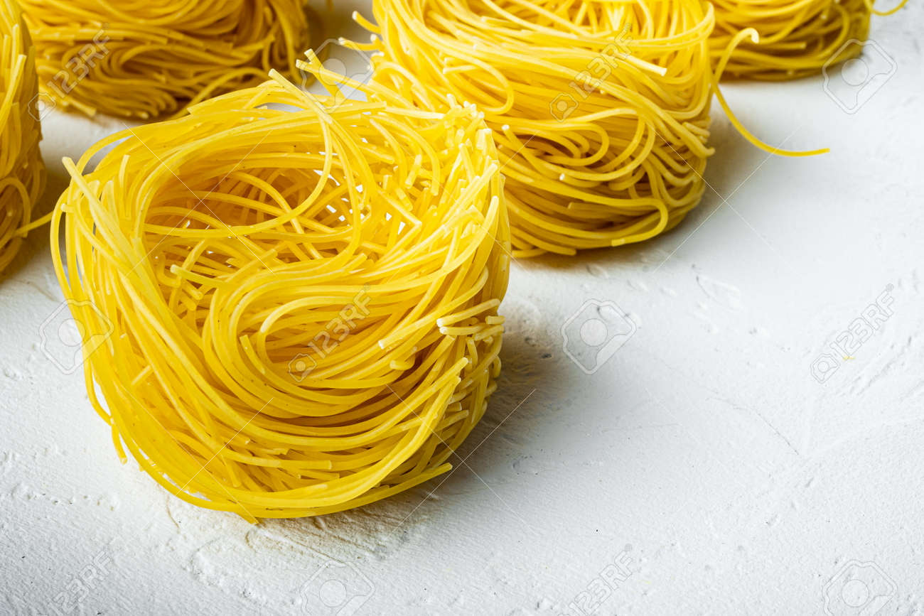 Durum Wheat Semolina Homemade Egg Pasta Tagliarini Set, On White Stone  Surface, With Copy Space For Text 正版图像123RF中国- 高质量免版税图像库. Image 183861740