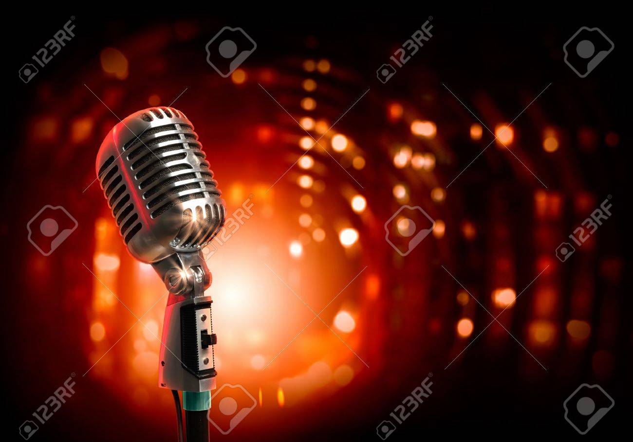 Single retro microphone against colourful background with lights - 17769574 Single retro microphone against colourful background with lights - 17769574