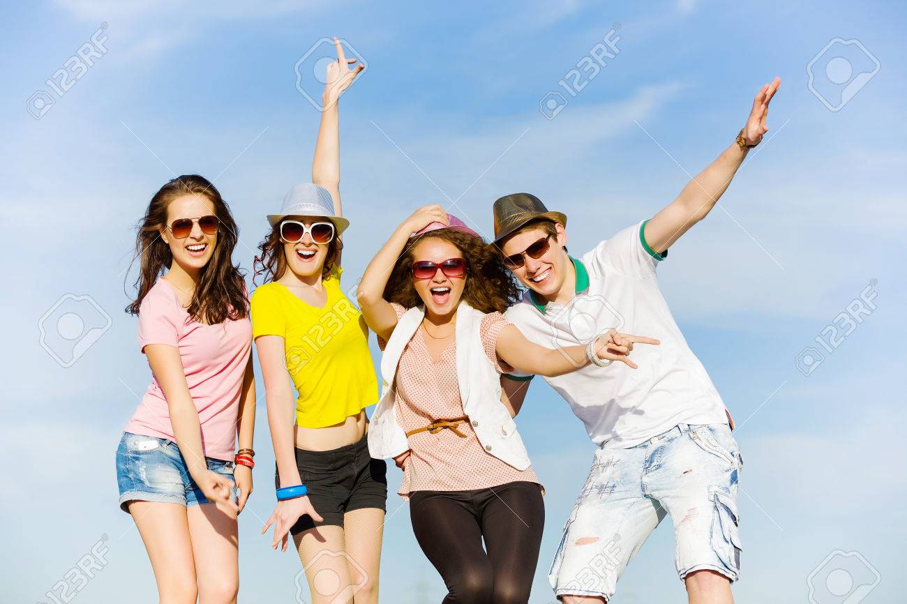 Young Happy People Having Fun Outside In Summer Stock Photo, Picture And  Royalty Free Image. Image 24648203.
