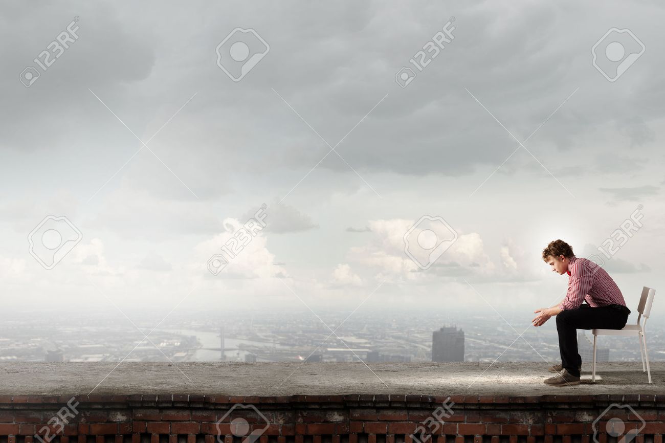 depressed man sitting on