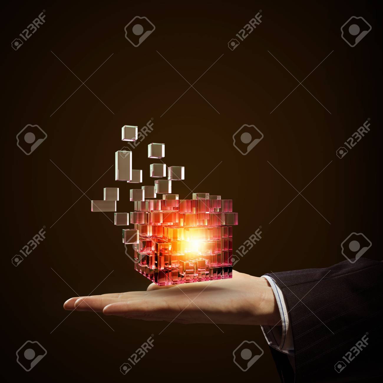 Businessman close view holding in hand magic glowing cube - 50964132 Businessman close view holding in hand magic glowing cube - 50964132