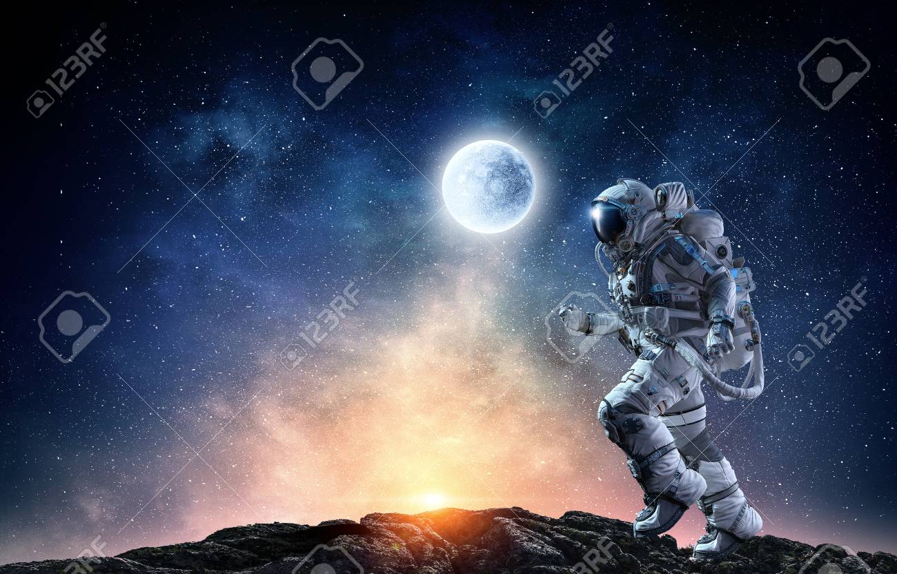 Astronaut in space suit running on planet surface. Mixed media - 90935740 Astronaut in space suit running on planet surface. Mixed media - 90935740