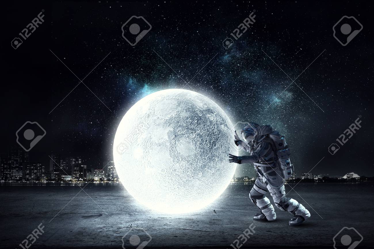 Astronaut in suit making planet roll. Mixed media - 92483313 Astronaut in suit making planet roll. Mixed media - 92483313