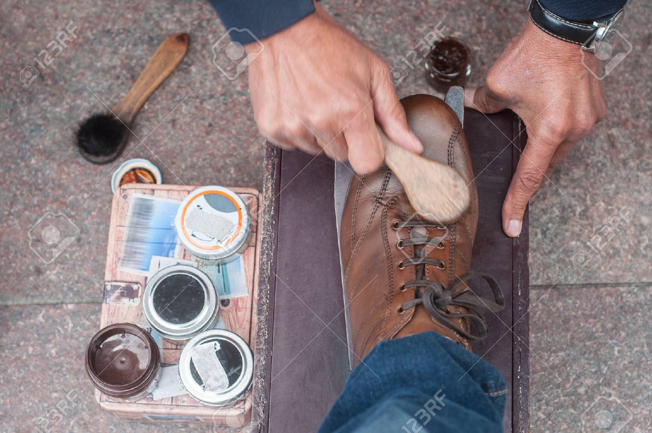 closeup of shoe shine in the street on brown leather shoes - 85399950 closeup of shoe shine in the street on brown leather shoes - 85399950